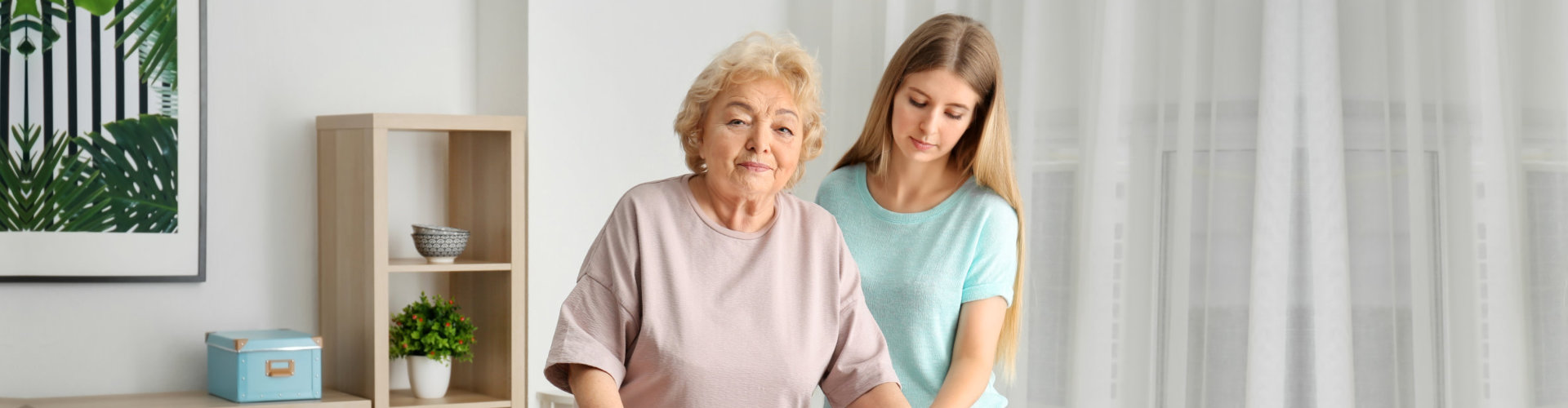 caregiver helping a senior woman